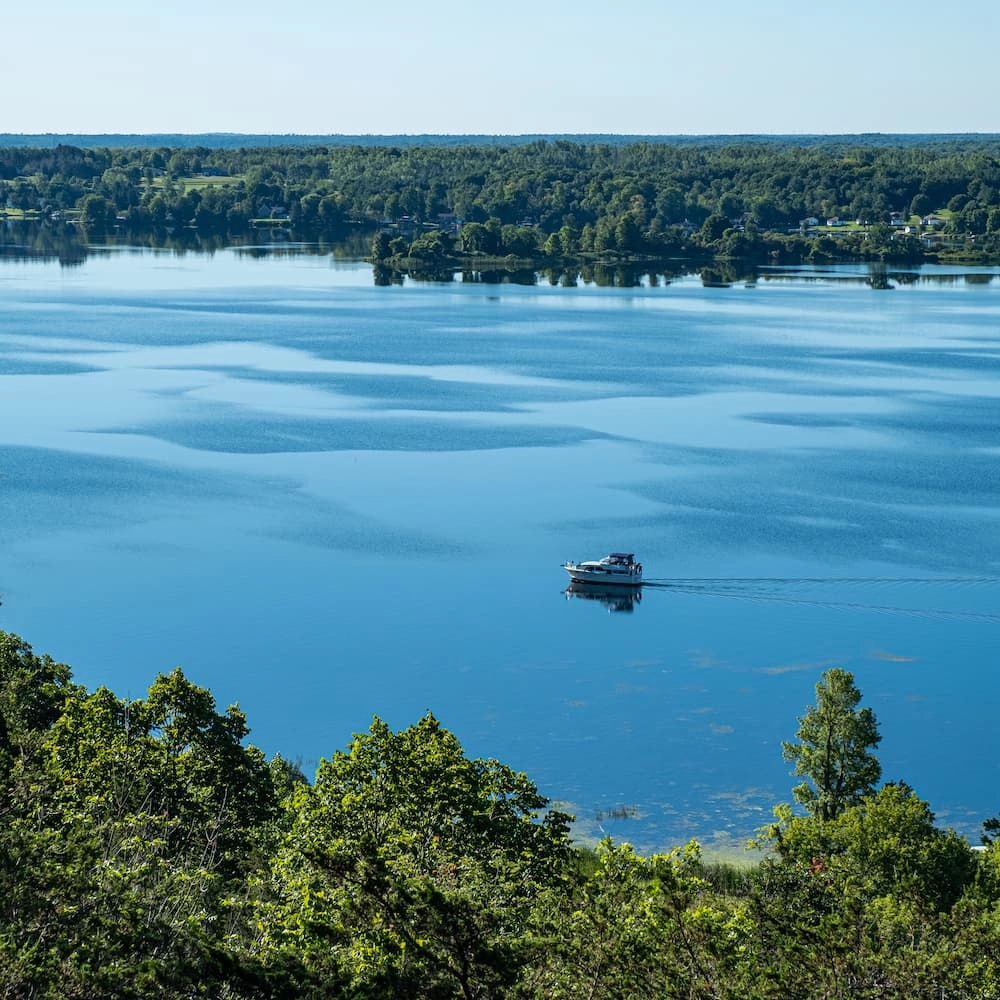 A boat on the Upper Rideau Lake next to Watercolour Westport.
