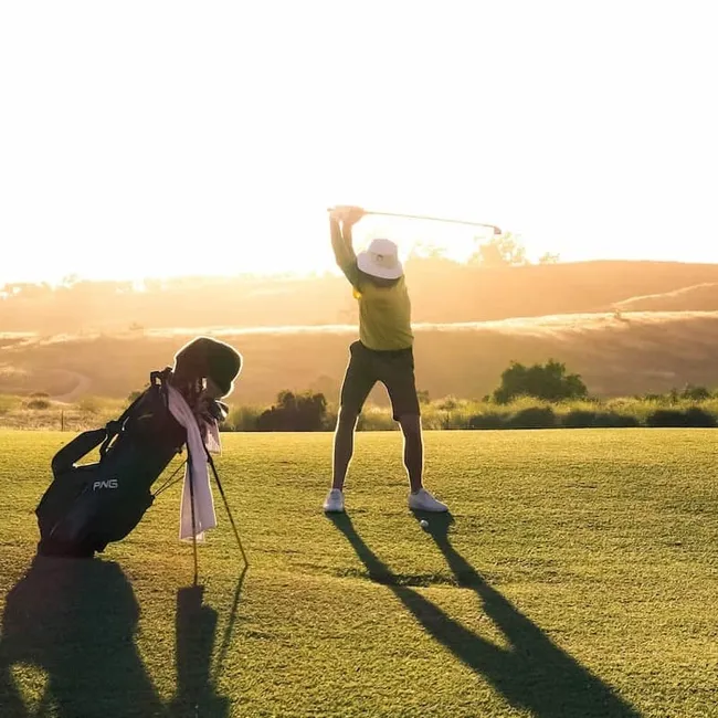 A man golfing at a golf course near Westport, Ontario.