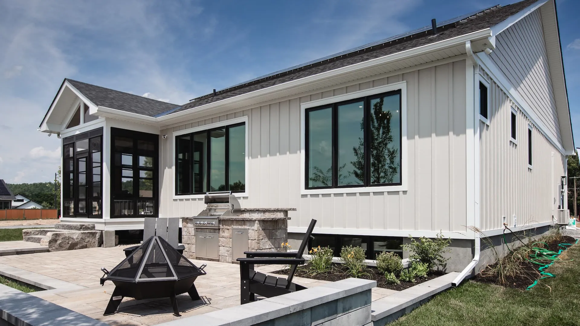 A backyard stone patio of a home in Watercolour Westport.