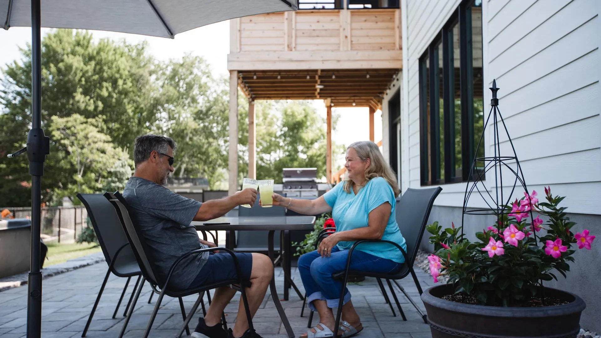 Two Watercolour Westport residents enjoying their backyard patio.