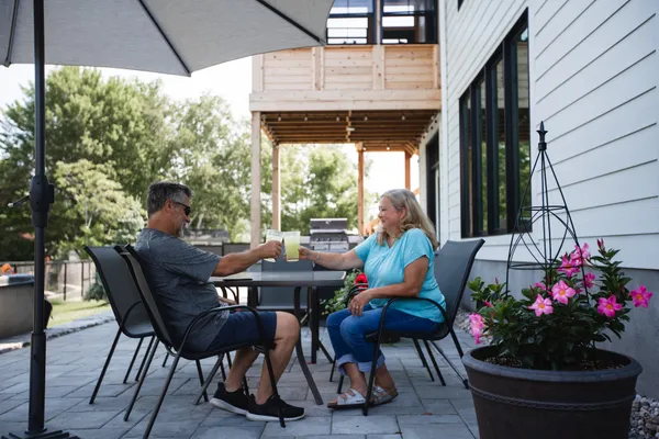 Two Watercolour Westport residents enjoying their backyard patio.