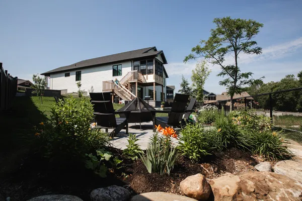 A backyard stone patio of a home in Watercolour Westport.