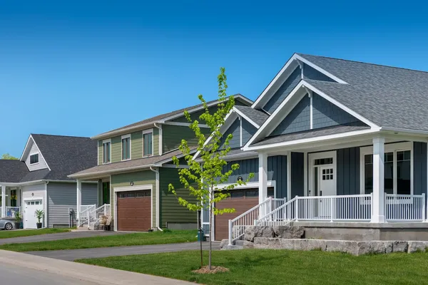 A streetscape of 3 homes in Watercolour Westport.