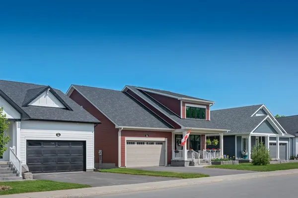 A streetscape of 3 homes in Watercolour Westport.