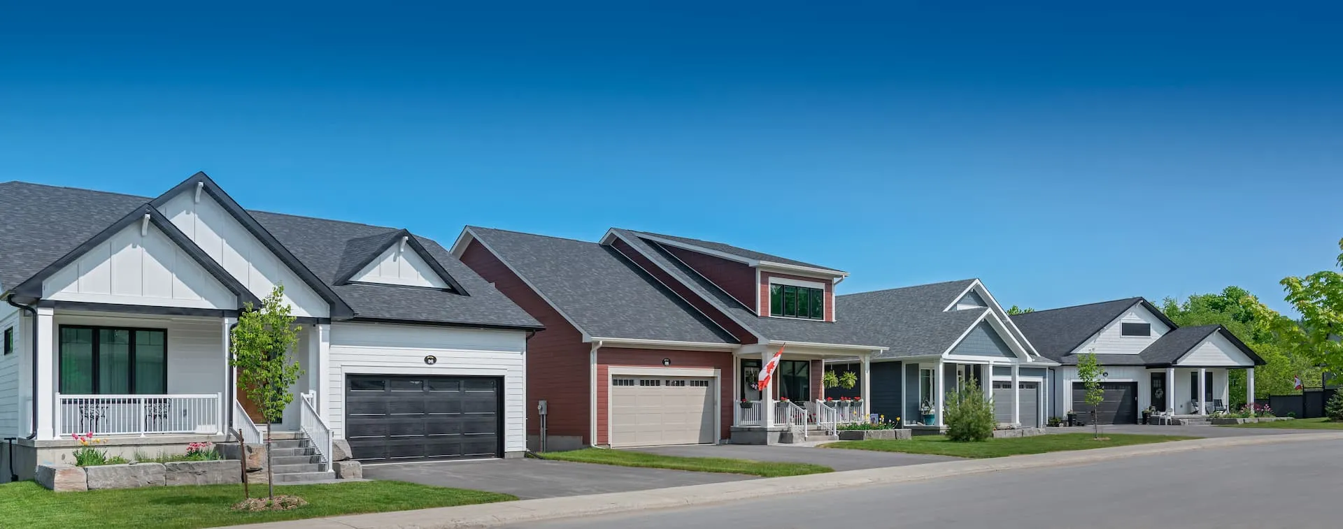 A streetscape of 3 homes in Watercolour Westport.