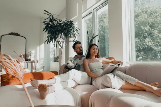 A young couple lounging in their home.